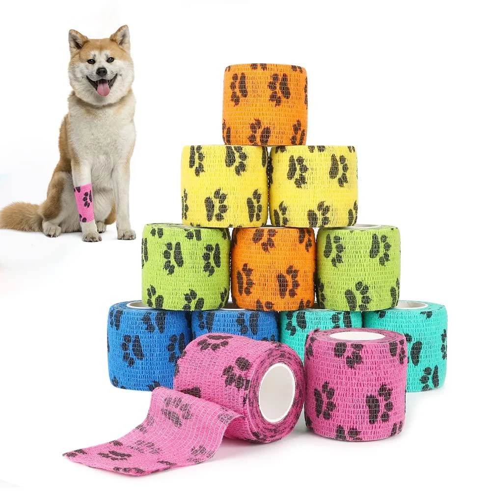 SlowTon Pet Self Adhesive Bandage Pet Vet Wrap Tape Waterproof Non-Woven Cohesive Gauze Rolls for Dog Cat Animals First Aid Wrap for Wrist Healing Ankle Sprain & Swelling 2" x 5 Yards(12 Rolls) Pawprint 2" Width X 12 Roll